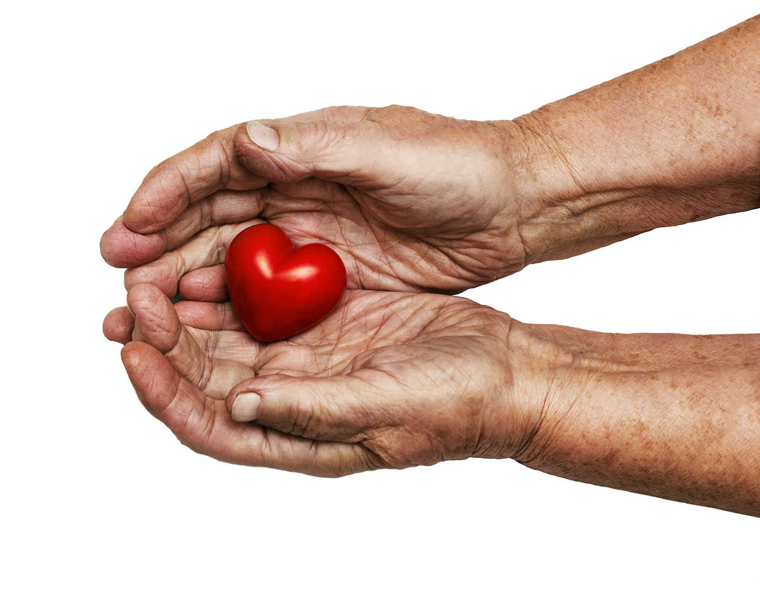 2 hænder der holder et rødt hjerte